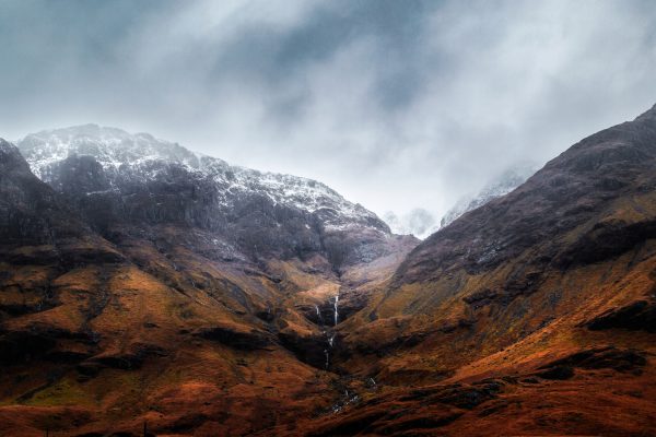 Glencoe, Scotland: stream in snowy mountains
